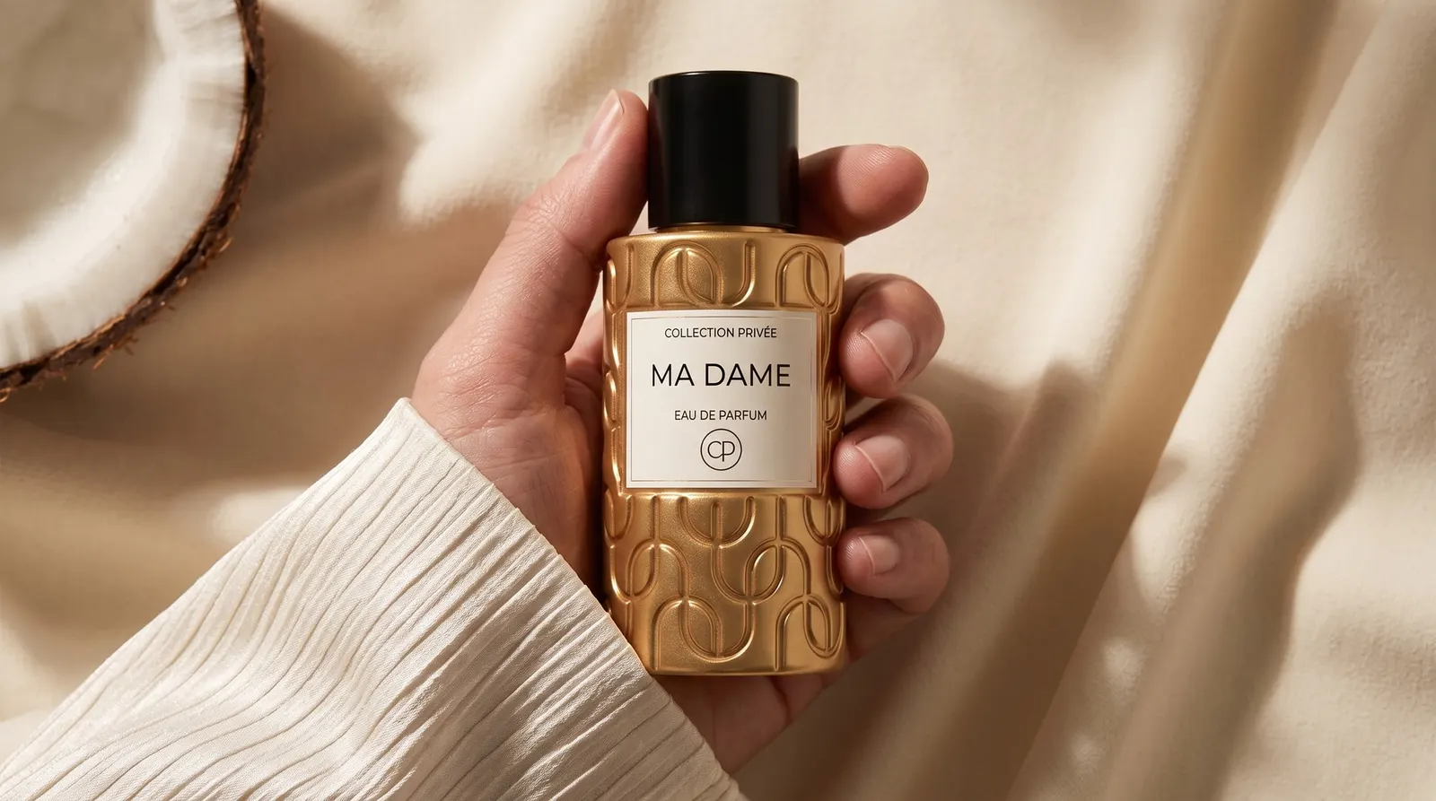 The fragrance ritual, a bottle of Ma Dame held in one hand